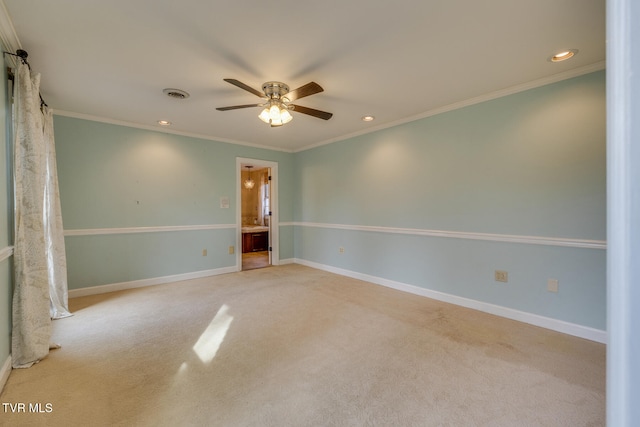 empty room featuring light colored carpet, ceiling fan, and ornamental molding