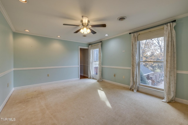 unfurnished room featuring light colored carpet and crown molding