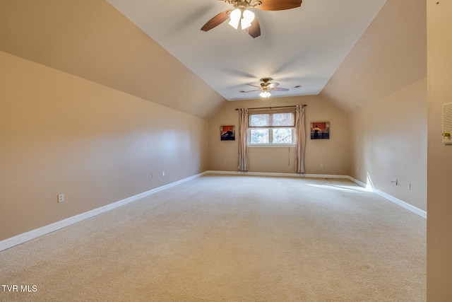 bonus room with light colored carpet, vaulted ceiling, and ceiling fan