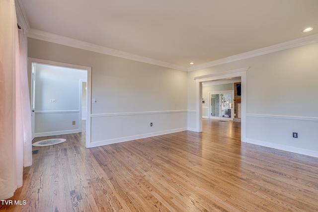 unfurnished room with light hardwood / wood-style floors and ornamental molding