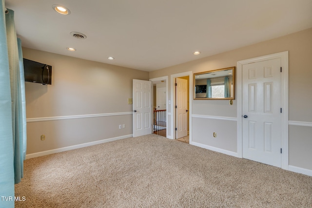 unfurnished bedroom with carpet flooring