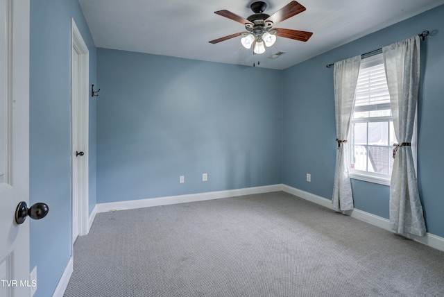 spare room with ceiling fan and carpet floors