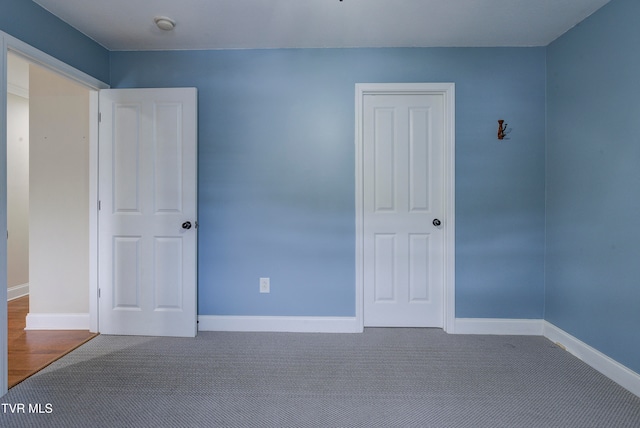 unfurnished bedroom featuring carpet