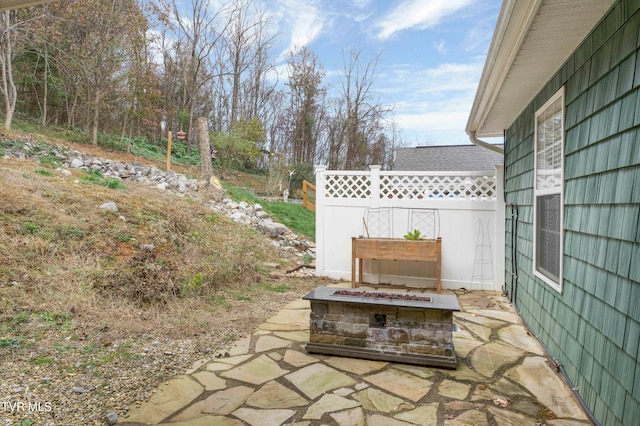 view of patio / terrace with an outdoor fire pit