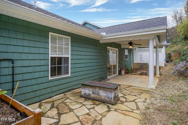 view of patio / terrace featuring ceiling fan and a fire pit