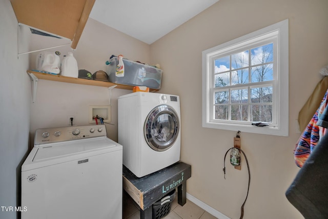 washroom featuring light tile patterned flooring and independent washer and dryer