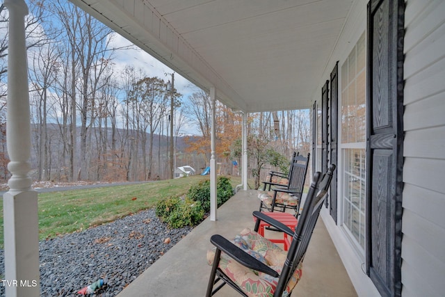 view of patio featuring a porch