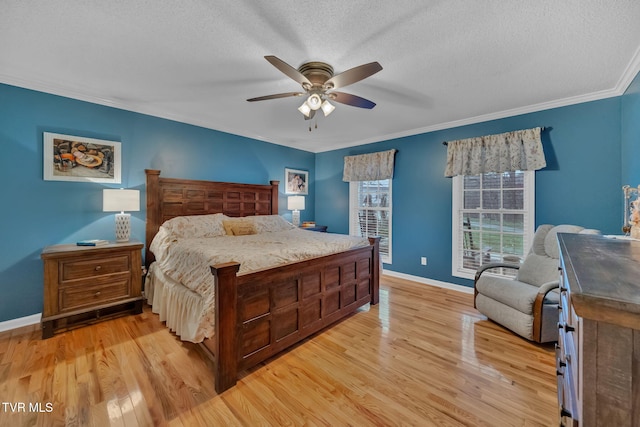 bedroom with ceiling fan, ornamental molding, a textured ceiling, and light hardwood / wood-style flooring