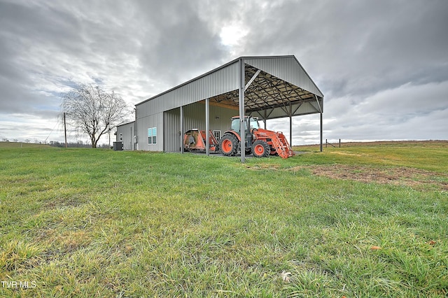 view of outdoor structure featuring a lawn