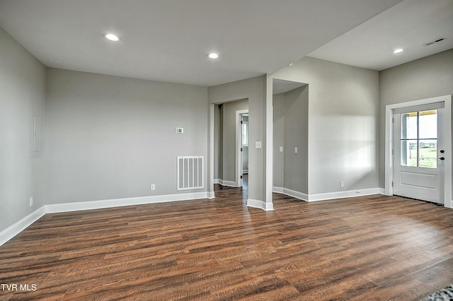 spare room with dark hardwood / wood-style flooring