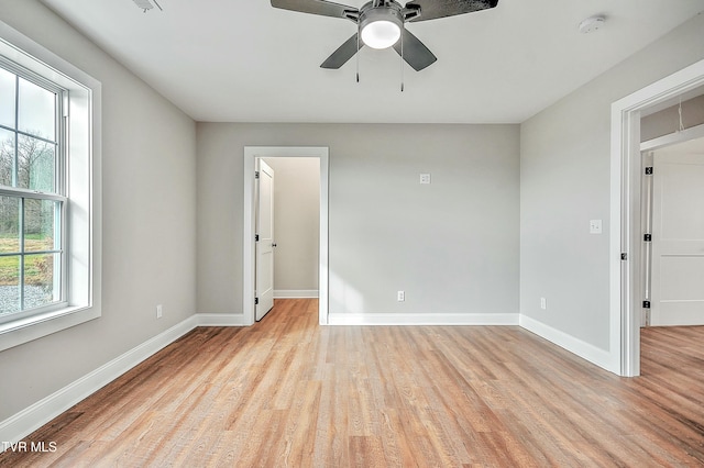 unfurnished room featuring light hardwood / wood-style floors and ceiling fan