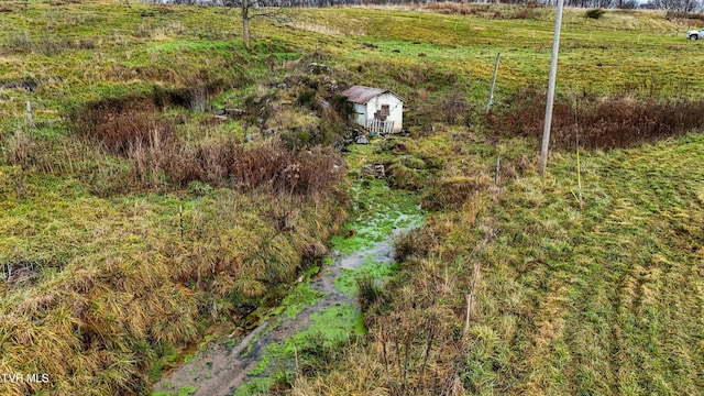 birds eye view of property featuring a rural view