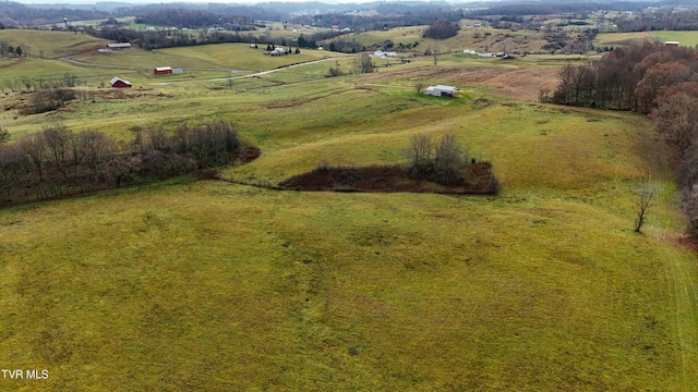 birds eye view of property featuring a rural view