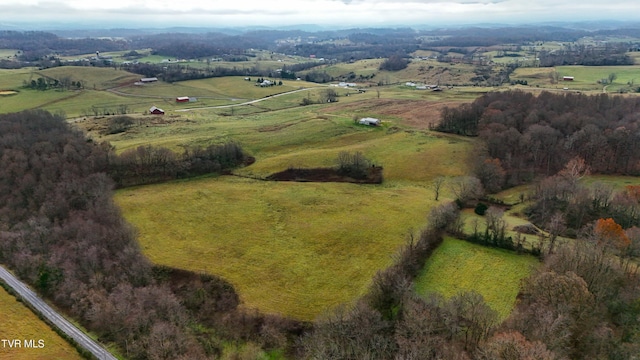 birds eye view of property with a rural view