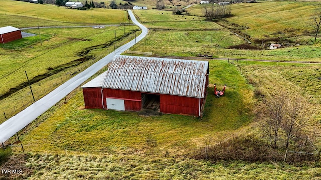 birds eye view of property featuring a rural view