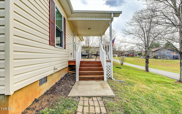 view of yard featuring covered porch