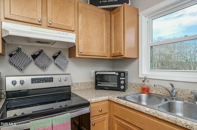 kitchen featuring electric stove and sink