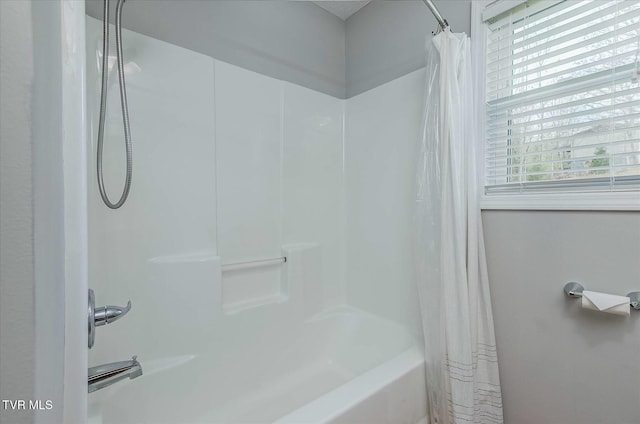 bathroom featuring shower / tub combo with curtain and a healthy amount of sunlight