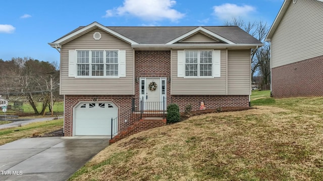 bi-level home with a front lawn and a garage