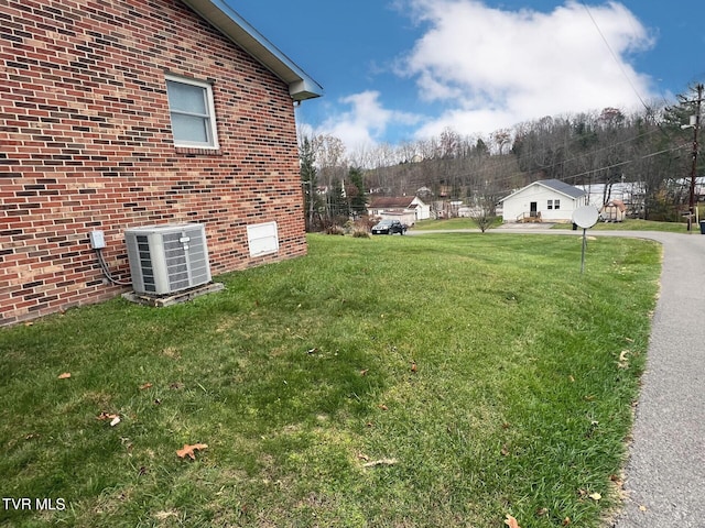 view of yard with central AC