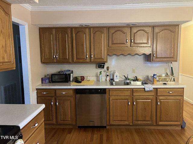 kitchen with stainless steel dishwasher, crown molding, light wood-type flooring, and sink