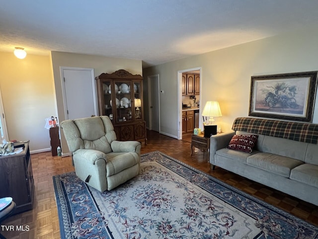 living room featuring dark parquet floors