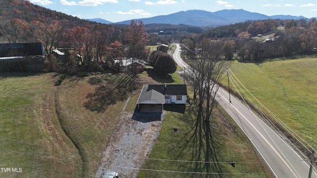 birds eye view of property with a mountain view