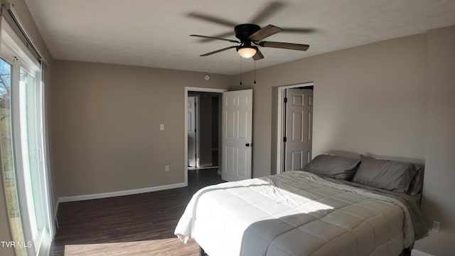 bedroom with ceiling fan and dark wood-type flooring