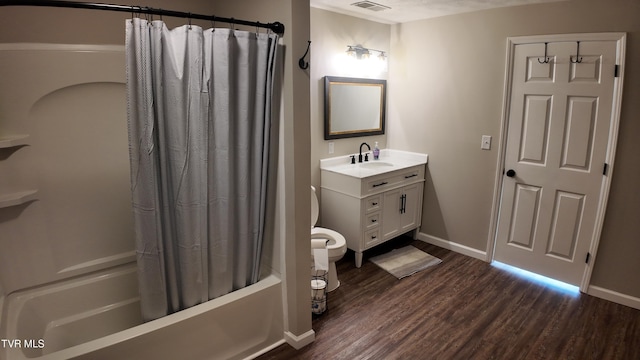 full bathroom with shower / bath combination with curtain, vanity, hardwood / wood-style flooring, and toilet