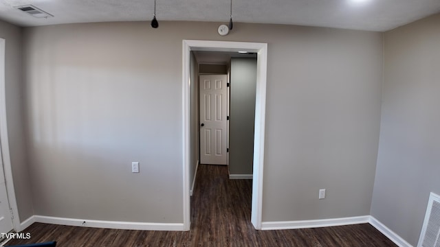 spare room featuring dark hardwood / wood-style floors