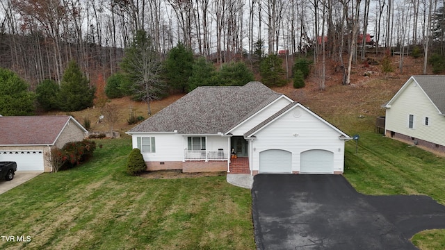 view of front of home with a garage, a front lawn, and a porch