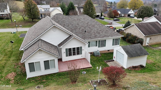 rear view of house with an outbuilding and a garage