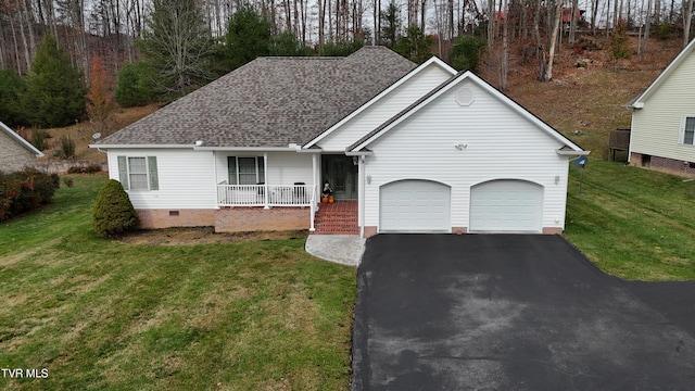 view of front of home with a garage, covered porch, and a front yard