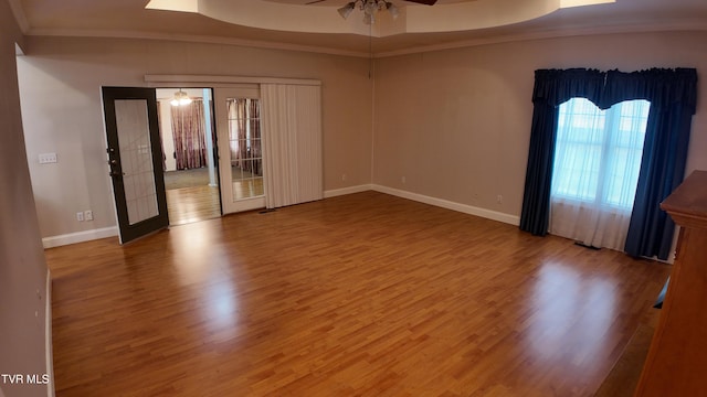 spare room featuring hardwood / wood-style floors, french doors, ceiling fan, and ornamental molding