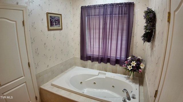 bathroom featuring a relaxing tiled tub