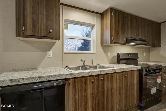 kitchen featuring sink, dark hardwood / wood-style floors, and black appliances