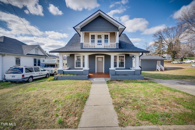 bungalow-style home featuring a front yard and a porch