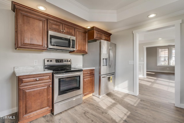 kitchen featuring crown molding, light hardwood / wood-style flooring, and appliances with stainless steel finishes