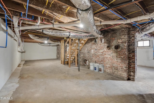 basement with brick wall