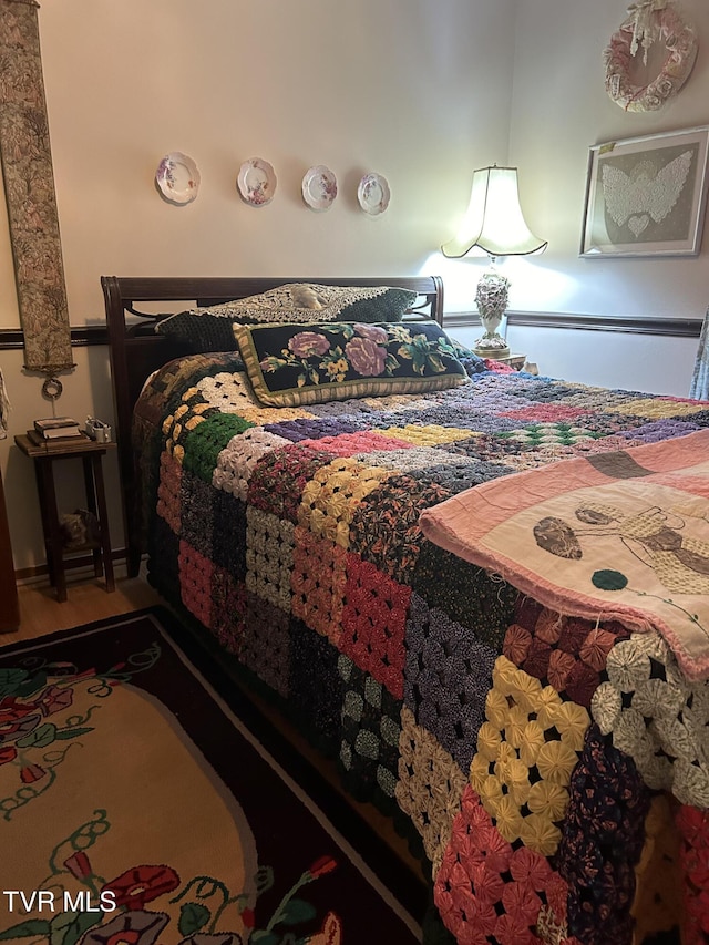 bedroom featuring hardwood / wood-style flooring