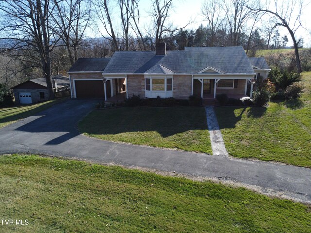 single story home with a front lawn and a garage