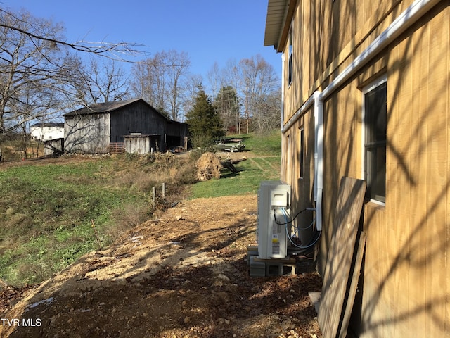 view of side of property featuring an outbuilding