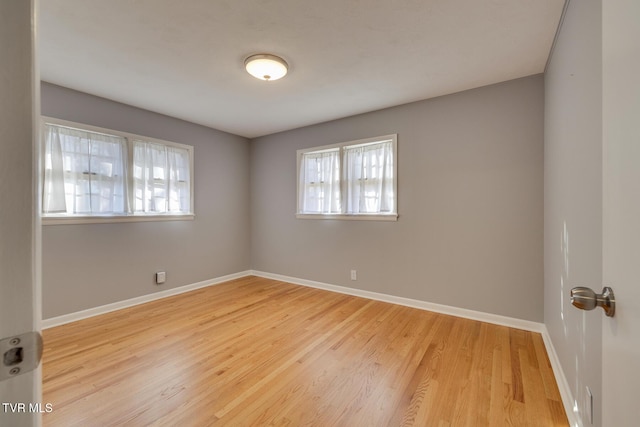 spare room featuring light hardwood / wood-style floors