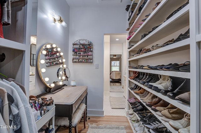 walk in closet featuring light hardwood / wood-style flooring