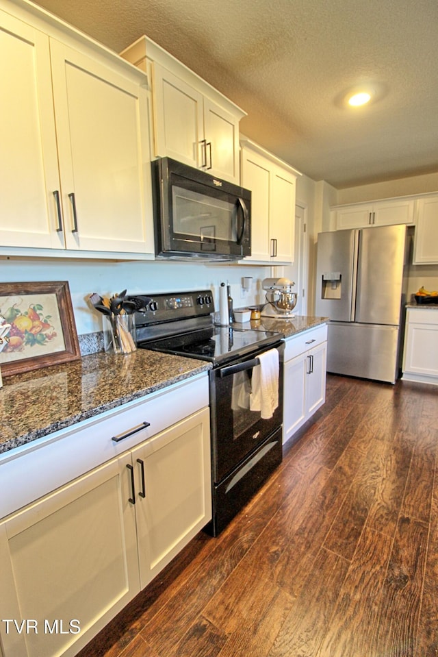 kitchen featuring black appliances, dark hardwood / wood-style flooring, white cabinetry, and a textured ceiling