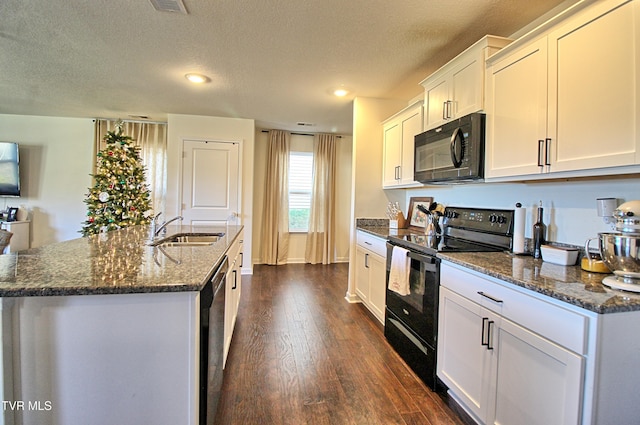 kitchen featuring a textured ceiling, dark wood-type flooring, sink, black appliances, and white cabinets