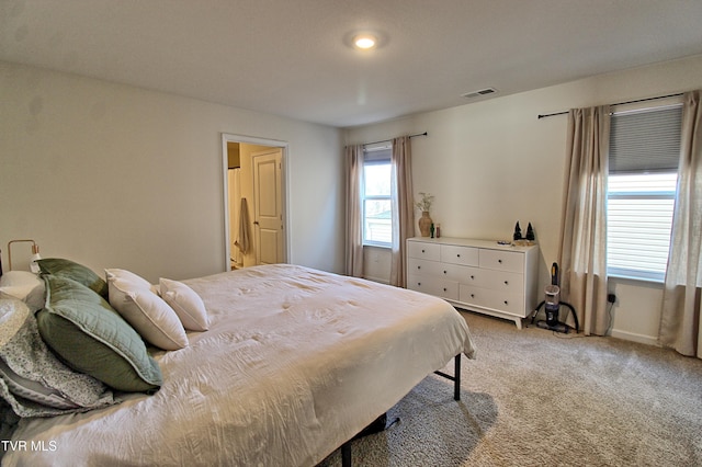 bedroom with light carpet