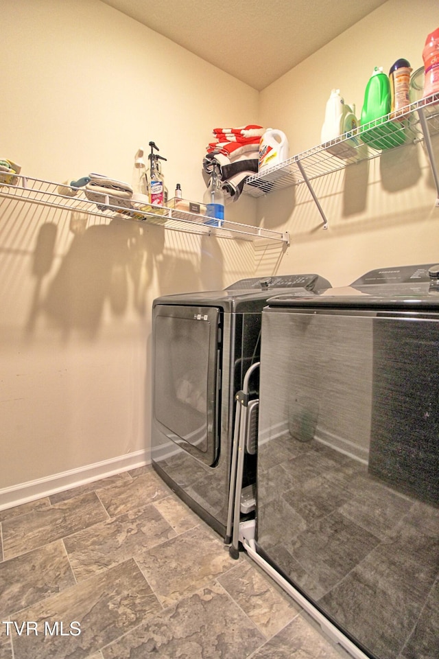 laundry room with washer and clothes dryer