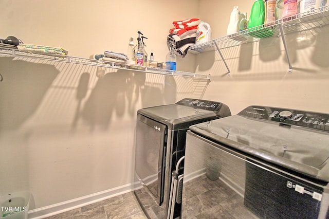 washroom featuring washer and clothes dryer