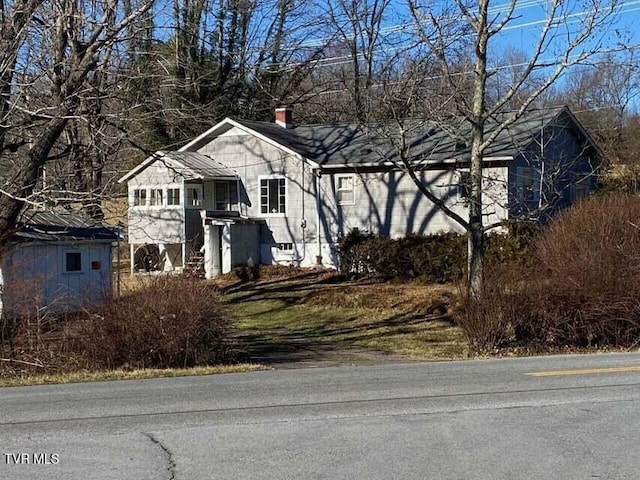 view of front of property with a chimney